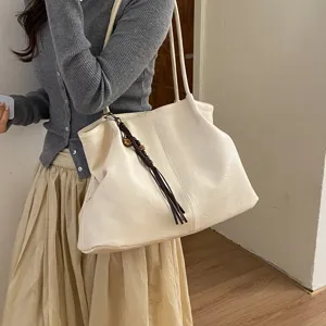 Minimalist beige tote bag for women, large capacity shoulder bag shown on model, casual daily