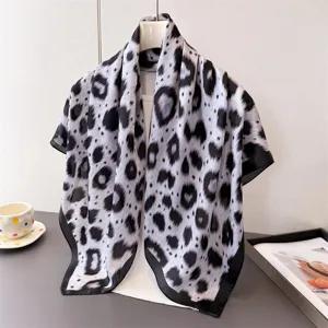 Black and white leopard print imitation silk square scarf, elegant neck accessory for women.