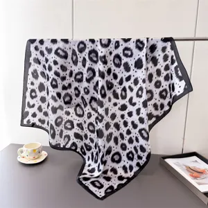 Elegant black and white leopard print imitation silk square scarf for women's daily wear.