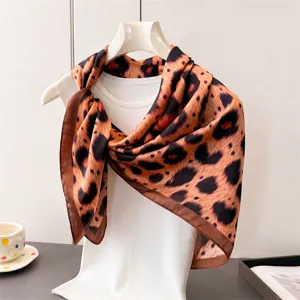 Elegant leopard print imitation silk square scarf, silky soft neckerchief accessory detail.