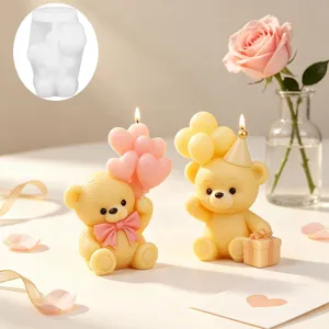 Close up of cute teddy bear candle silicone mold and finished romantic scented candles.