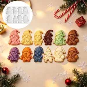 Detailed view of 8-cavity Christmas gnome silicone molds with colorful baked cookies setup.