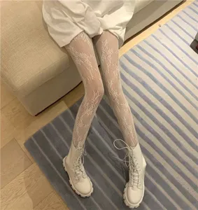 White floral lace fishnet pantyhose for women, retro Lolita style sheer leg tights detailed view.