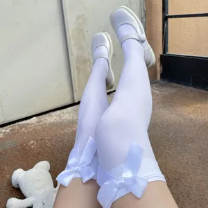White over-the-knee lolita stockings with sweet satin bows, cute kawaii japanese thigh high socks.