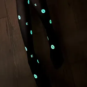 Glow in the dark black pantyhose with glowing lips and letter prints for halloween party