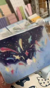 Starry sky aesthetic notebook cover detail with cute meteor design and smooth texture.