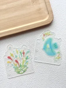 Close-up detail of translucent frosted binder index pages with cute colorful illustration.