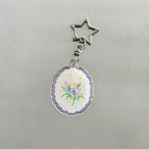 Acrylic pixel flower keychain with star clasp, cute aesthetic pendant for planners and bags.