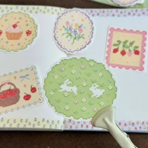 Cute pixel art decorative stickers detail view, cross-stitch style cute stationery items.