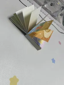 Detailed view of the creative art memo pad showing intricate landscape page illustrations.