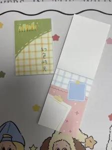 Close up of cute sticky notes and memo pads with colorful illustration design, detail view.