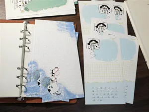 A6 loose-leaf planner inserts with cute cat illustrations and calendar design, perfect for journal.