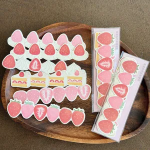 Cute strawberry long sticky notes detail view, sweet dessert style memo pads for daily journaling.
