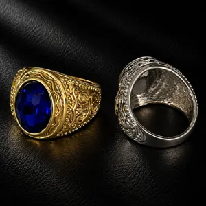 Close-up detail of retro hip-hop carved wide statement rings with blue stone inlay for men.