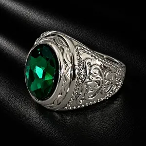 Men vintage wide silver ring with large oval green gemstone and intricate carved filigree details.