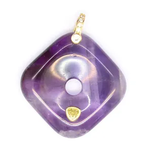Exquisite square amethyst pendant with gold bail and yellow stone detail, elegant jewelry item.