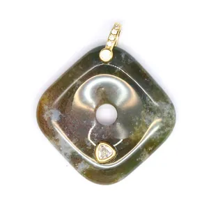 Close-up detail of natural agate square pendant with gold tone bail and shimmering zircon.