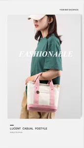 Canvas tote bag detail view, casual pink and cream design with front pocket and sturdy handles.