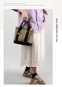 Detailed view of the stylish canvas tote bag with sturdy black handles and practical capacity.