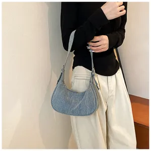 Detailed close-up view of casual fashion denim hobo shoulder bag with metal hardware.