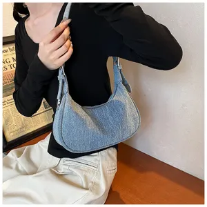 Stylish light blue denim hobo shoulder bag for women, trendy 2025 autumn casual daily dumpling handbag.