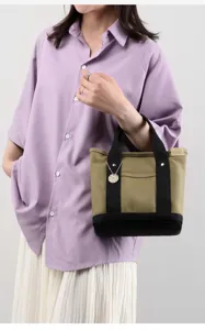 Classic canvas tote handbag for women, casual small shoulder bag with contrast color design.