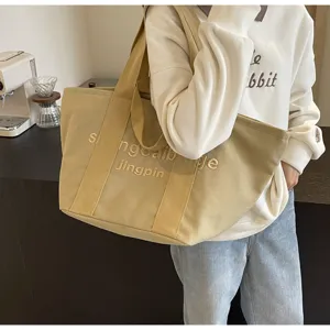 Grosse Canvas-Tragetasche mit Stickerei, modische Freizeittasche fur Alltag und Pendeln.