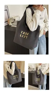 Große Canvas Umhängetasche für Damen, stilvoller dunkelgrauer Shopper mit edler Goldstickerei.