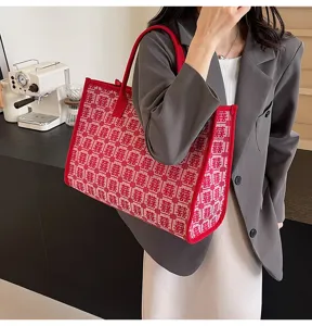 Close up of red double happiness pattern tote bag detail, elegant wedding accessory design.