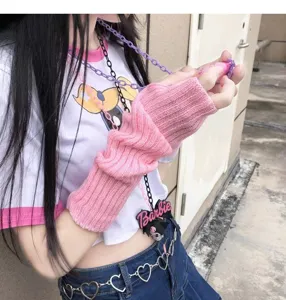Detail shot of Japanese Harajuku pink knitted arm sleeves, showcasing the soft texture and fit.