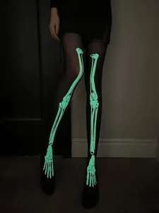 Medias de esqueleto que brillan en la oscuridad, mallas negras de huesos fluorescentes verdes