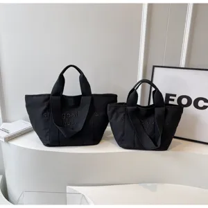 Schlichte schwarze Segeltuch Tragetaschen Set, gross und klein für Pendeln.