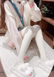 Close-up detail of white vertical striped over-the-knee socks, soft knitted texture, JK style.