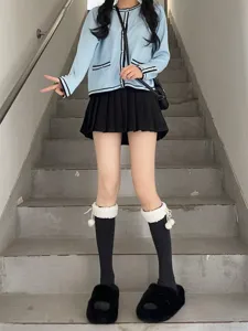 Japanese fleece-lined mid-calf socks with white plush cuffs and cute pom-pom details for autumn and winter.
