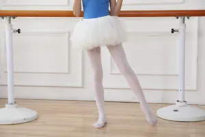 Close-up detail view of professional white ballet dance tights for kids, smooth velvet.