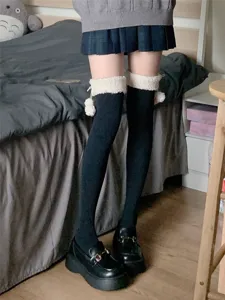 Japanese fleece-lined over-the-knee socks with cute white fluffy cuffs and pom-pom decor.