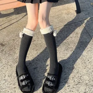 Japanese style autumn winter black mid-calf socks with white plush pom-poms for daily wear