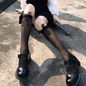 Japanese JK lolita black velvet knee high socks with sweet bows and shiny mary jane shoes.