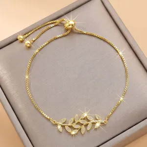Bracciale regolabile in zircone cubico con foglie dorate, elegante gioiello da polso per donne.