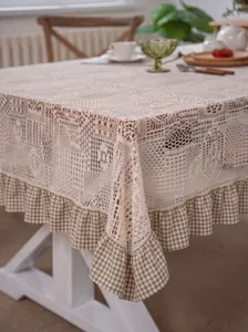 Vintage crochet lace tablecloth with checkered ruffle edge for elegant home dining table decor.