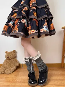 Knit leg warmers with lace frills and bows, Japanese Lolita style sweet footwear detail.