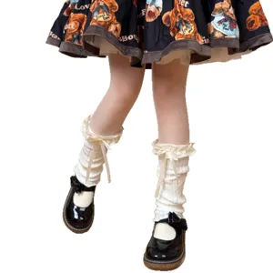 Japanese sweet lolita white lace ruffle leg warmers with cute bows and black shoes.