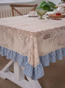 Pastoral crochet hollow tablecloth with blue gingham ruffle for dining table decor.