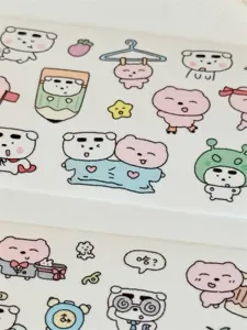 Cute puppy and sleepy bear PET sticker roll for journaling and DIY decorative crafts detail.