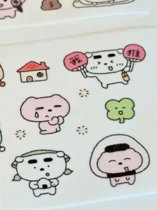 Cute pet washi tape sticker roll detail showing lovely bear and puppy cartoon illustrations.