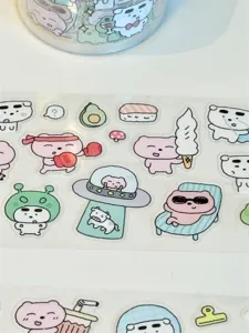 Detailed close-up shot of cute cartoon PET decorative stickers featuring various playful animal designs.