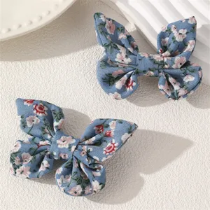 Cute blue floral fabric bow hair clips for kids, perfect sweet hair accessories for girls.