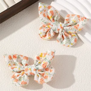 Cute floral fabric bow hair clips for kids, sweet dual hairpins for girls' cute hairstyles.