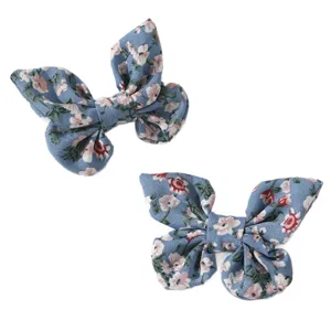 Cute blue floral fabric butterfly hair clips for girls, perfect for daily hairstyles and ponytails.