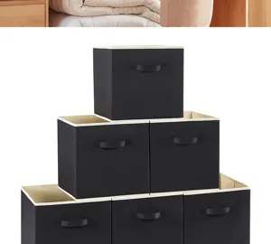 Détail de la boîte de rangement pliable en tissu noir, poignée solide et design ouvert.
